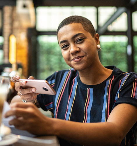 Woman taking photo of check.