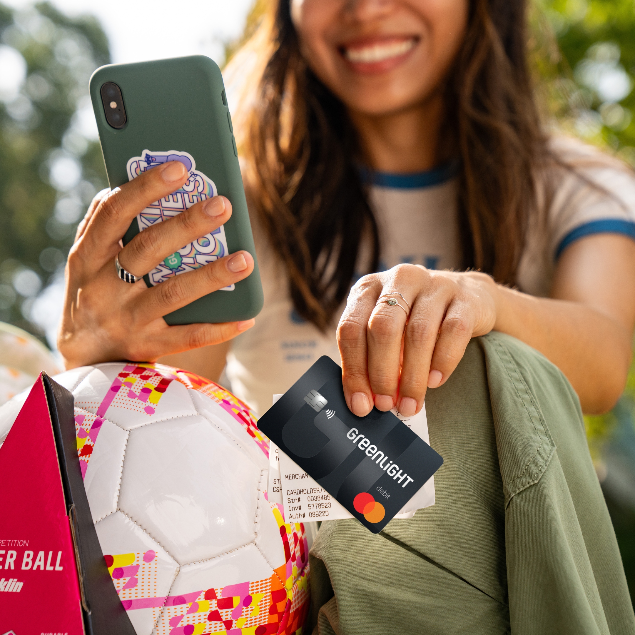 Teen with Greenlight card