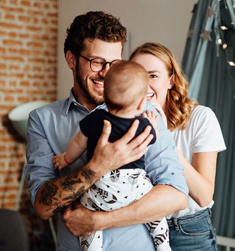 Young parents in nursery.