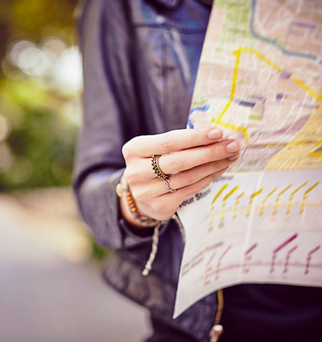 Woman holding map.