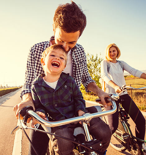 Parents and child biking.